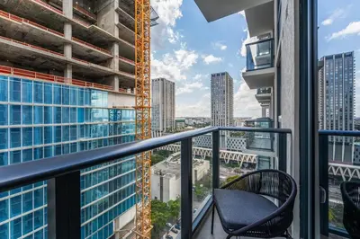 a balcony with a view of a building at Crosby Miami WTC Studio Sleek #2506 in Miami