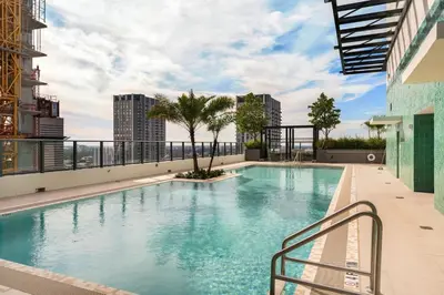 a large swimming pool on the roof of a building at Crosby Miami WTC 1BR 1BA Central Stay #1405 in Miami