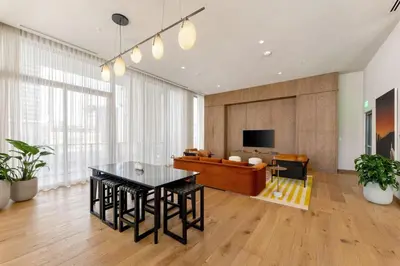 a living room with a table and a couch at Crosby Miami WTC 2BR 2BA Corner City Residence #601 in Miami