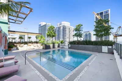 a swimming pool on top of a building with buildings at Central Downtown Condo with Pool and Gym in Miami