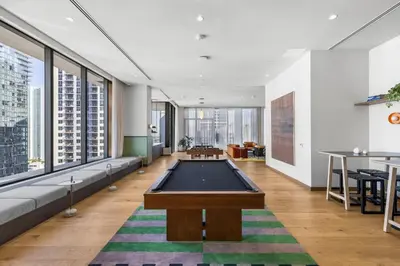 a living room with a pool table in it at Central Downtown Condo with Pool and Gym in Miami