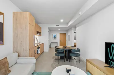 a living room with a couch and a table at Central Downtown Condo with Pool and Gym in Miami