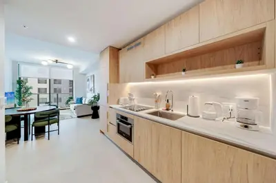 a kitchen with a sink and a counter top at Sky Sanctuary with Rooftop Pool & Hot tub in Miami