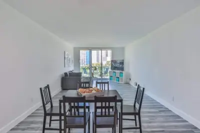 a dining room with a table and chairs at Center of Joy in Sunny Isles Beach