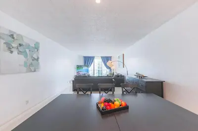 a bowl of fruit on a table in a living room at The Elevated Above STR-02687 in Sunny Isles Beach