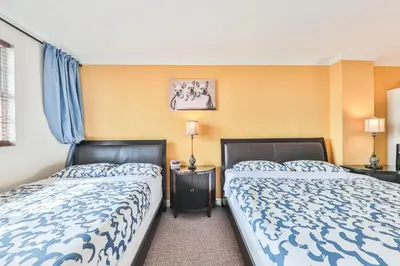 two beds sitting next to each other in a bedroom at Ocean view Penthouse - Royal stay in Sunny Isles Beach