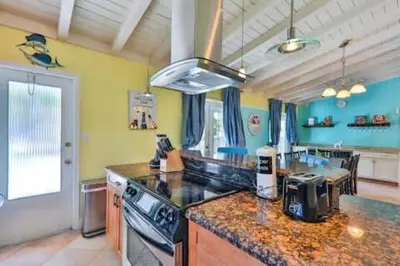 a kitchen with a counter top and a stove at LUX View Villa in Fort Lauderdale