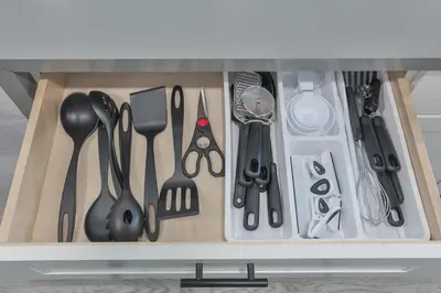 a drawer filled with utensils in a kitchen at Miami Cruise Family House in Fort Lauderdale