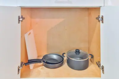 two pots sitting inside of a cabinet at Student Villa House STR-2000 in Hollywood