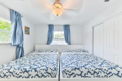 a bedroom with two beds and a ceiling fan at Fantastic Family Nest for Joy STR-2310#1 in Fort Lauderdale