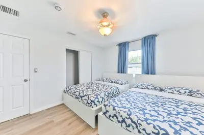 a bedroom with two beds and a ceiling fan at Fantastic Family Nest for Joy STR-2310#1 in Fort Lauderdale