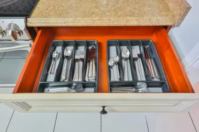 an orange drawer filled with utensils in a kitchen at Hard Rock Family House in Fort Lauderdale