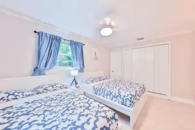 a bedroom with two beds and a window at Cruise Family house STR-1761 in Fort Lauderdale