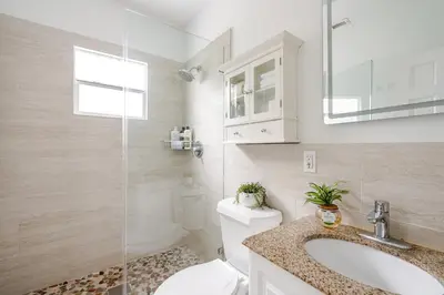 a bathroom with a toilet and a sink and a shower at Sunset Villa- 3 Bedroom 2 Bathroom -6 Beds in Miami