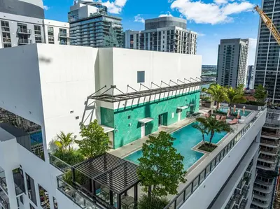 an aerial view of a building with a swimming pool at Urban Oasis Luxury Suite- Sky High Amenities in Miami