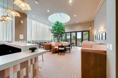 a restaurant with a waiting room with tables and chairs at Urban Oasis Luxury Suite- Sky High Amenities in Miami