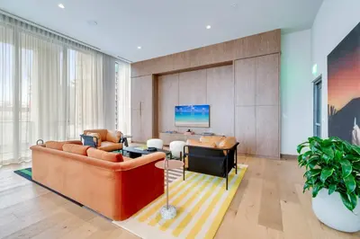 a living room with a couch and a table at Urban Oasis Luxury Suite- Sky High Amenities in Miami