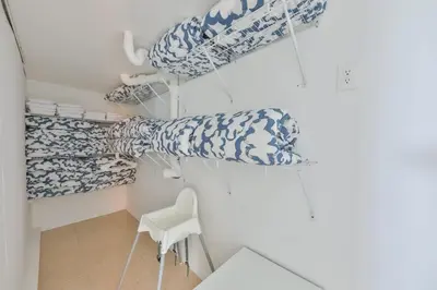 a room with blue and white towels and a chair at Up and down - flat Are boring villa in North Miami Beach