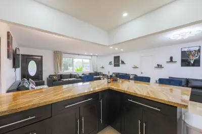 a kitchen with a large wooden counter top at Marble Villa Prime Location in Hollywood