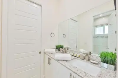 a white bathroom with a sink and a mirror at Luxury Family Davie Rancho STR-6114 in Davie