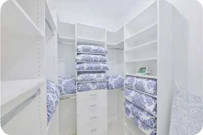 a white walk in closet with blue and white dishes at Luxury Family Davie Rancho STR-6114 in Davie