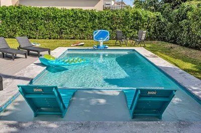 a swimming pool with a blue dolphin in the water at The Design District Pool House in Miami