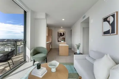 a living room with a couch and a table at Crosby Miami WTC 2BR 2BA High Floor Corner #3101 in Miami