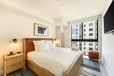 a bedroom with a bed and a large window at Crosby Miami WTC 1BR 1BA Chic Flawless New #2913 in Miami