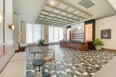 a lobby with chairs and a table in a building at Crosby Miami WTC 1BR 1BA Chic Flawless New #2913 in Miami