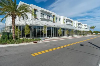 an empty street in front of a large building at Coastal 2BR-2BA Oasis Beach Pool Parking EV Estation in Hallandale Beach