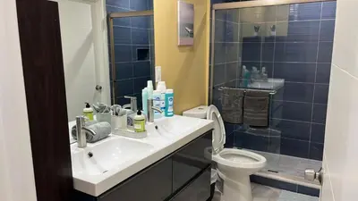 a bathroom with a sink and a toilet and a shower at Villa la Morada - Live stress-free in fully furnished, all-inclusive corporate housing! in Miami