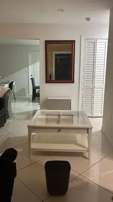 a white living room with a glass coffee table at Villa la Morada - Live stress-free in fully furnished, all-inclusive corporate housing! in Miami