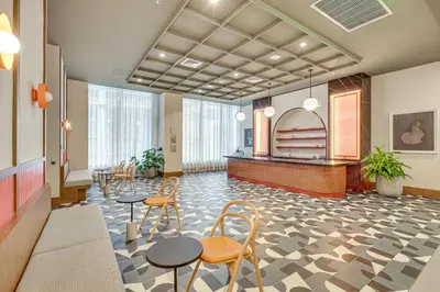 a lobby with tables and chairs in a building at Luxe High-Rise Living! Crosby Condo with Ocean View in Miami