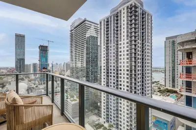 a balcony with chairs and a view of a city at Luxe High-Rise Living! Crosby Condo with Ocean View in Miami