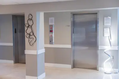 an elevator in a building with a metal door at Penthouse 1BR Miami Beach, amazing Ocean and Skyline views in Miami Beach