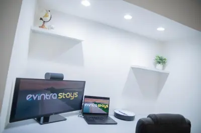 a desk with a television and a laptop on it at Penthouse 1BR Miami Beach, amazing Ocean and Skyline views in Miami Beach