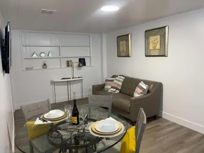 a living room with a couch and a table at Comfort Apartment Miramar in Miramar