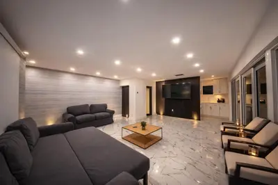 a living room with a couch and a table at The Rose By Brikell in Miami