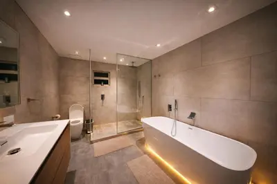 a bathroom with a tub and a shower and a toilet at The Rose By Brikell in Miami