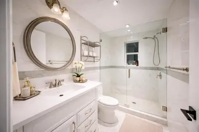 a bathroom with a shower and a toilet and a sink at The Rose By Brikell in Miami