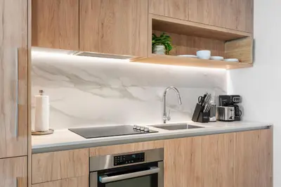a kitchen with a sink and a counter top at Luxury Urban Comfort at The Crosby Miami - Central Location in Miami