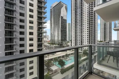 a balcony with a view of some buildings at Luxury Urban Comfort at The Crosby Miami - Central Location in Miami