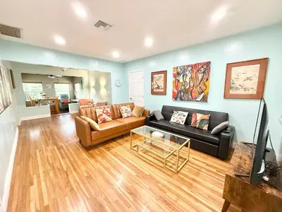 a living room with a couch and a table at Coconut Villa in Hollywood