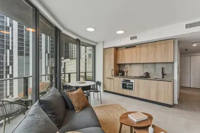 a living room with a couch and a kitchen at City View Condo - Prime Downtown Miami in Miami