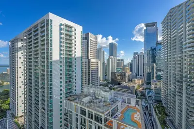 an aerial view of a city with tall buildings at Luxury 2BD Corner Loft with Stunning Miami River View in Miami