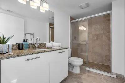 a bathroom with a toilet and a shower at Luxury 2BD Corner Loft with Stunning Miami River View in Miami