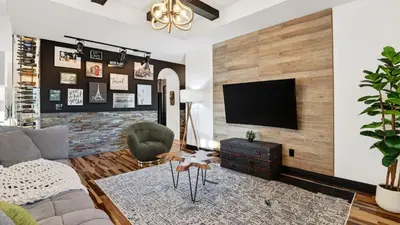 a living room with a couch and a tv at Riverside Veranda by AvantStay Waterfront Stay Infinity Pool Private Dock Easy Beach Access in Dania Beach