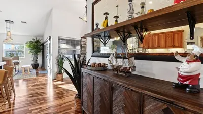 a home with a santa clause in a kitchen at Riverside Veranda by AvantStay Waterfront Stay Infinity Pool Private Dock Easy Beach Access in Dania Beach