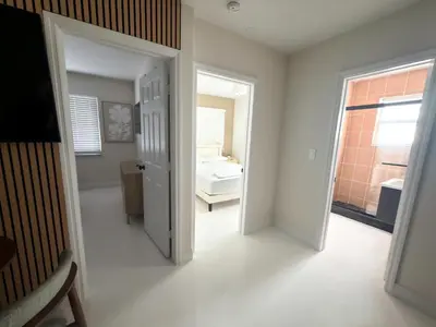 a white room with a bathroom with a sink at MB Playa Hotel & Apartments in Miami Beach