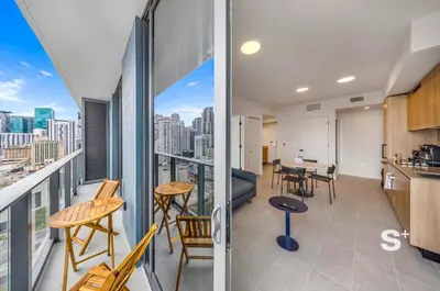 an apartment with a balcony with a view of the city at Downtown Miami Cozy 1BR with Views in Miami